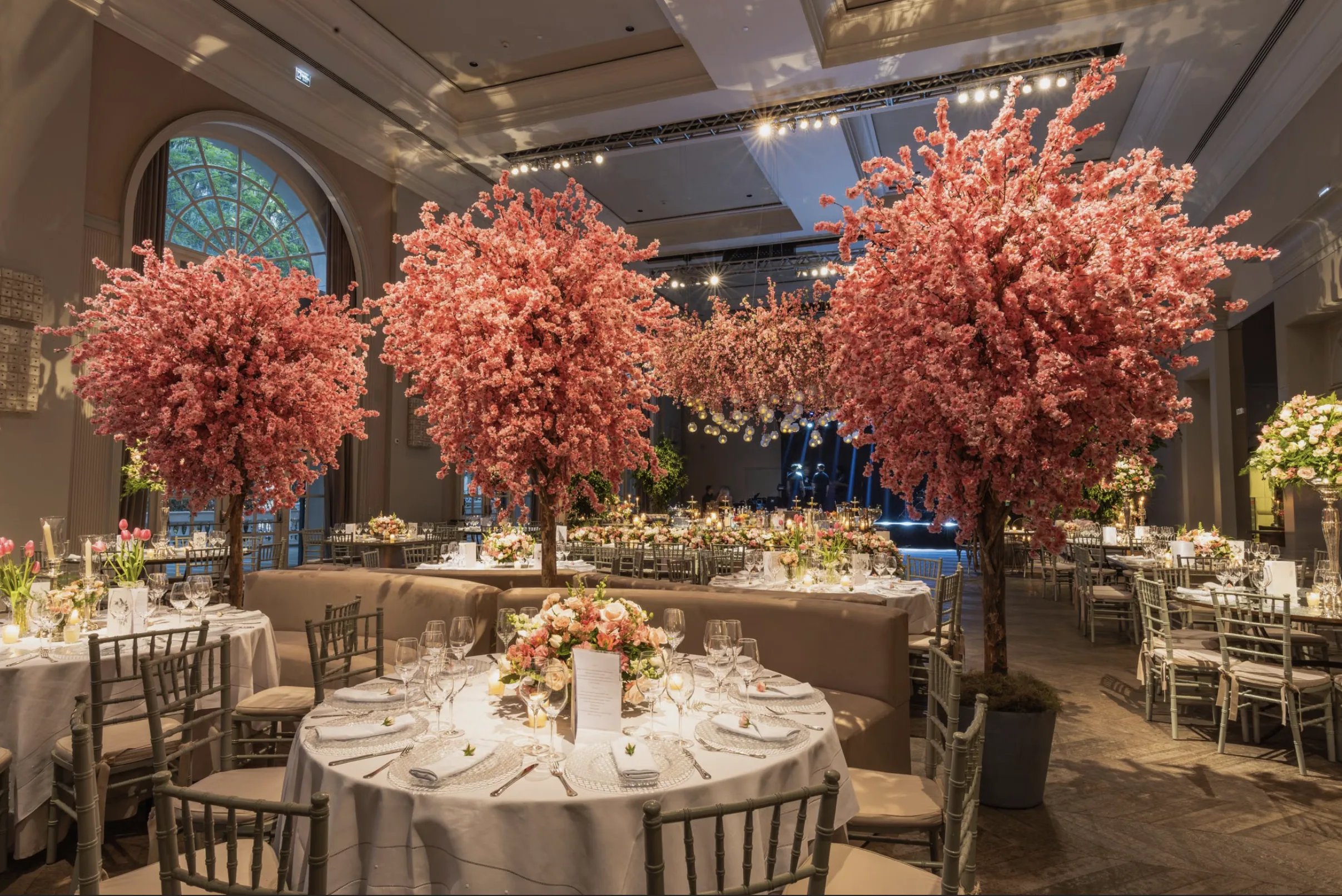 Grand wedding reception decor with stage and guest tables